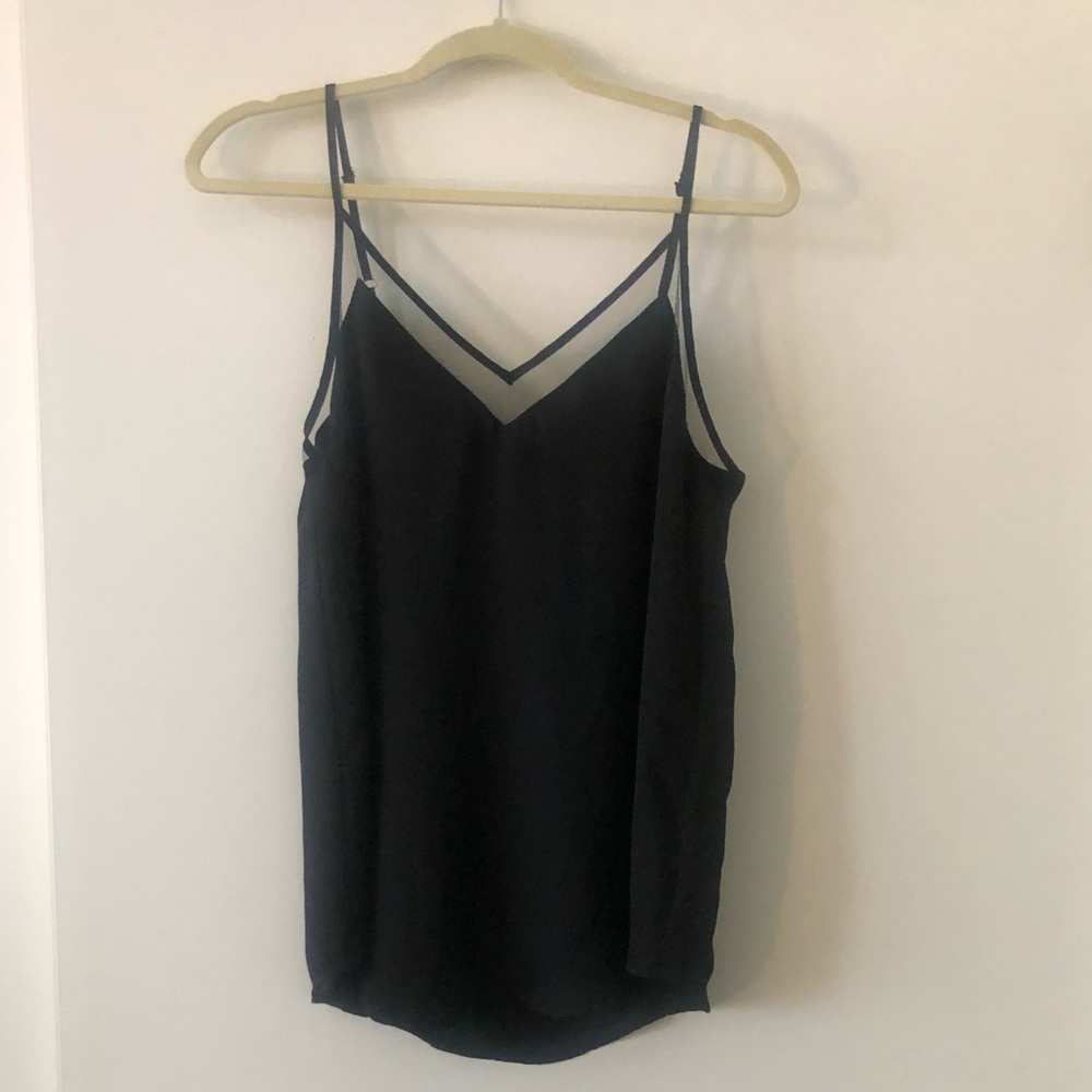 Lulu’s black tank top with sheer v-neck detail.